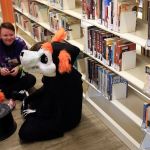 Peter Klein (left) and Ashen Wilson take a break during the Sno-Isle ComicCon on Sunday morning at the Snohomish Library. (Kevin Clark / The Herald)