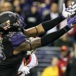 Washington tight end Darrell Daniels reaches out for a reception against Southern California on Saturday night at Husky Stadium in Seattle. (Kevin Clark / The Herald)