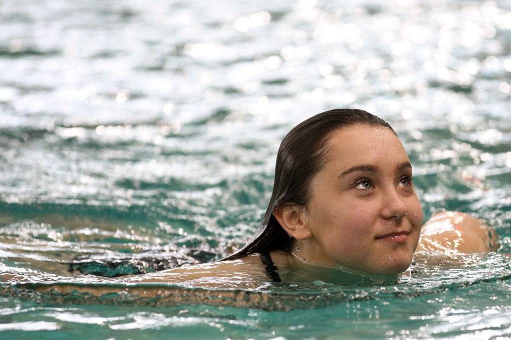 Monroe junior Payton Leidholm warms up for the 4A District 1 dive prelims Wednesday afternoon at the Snohomish Aquatic Center. (Kevin Clark / The Herald)