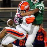 Lakes&rsquo; Cody Roe breaks up a pass intended for Edmonds-Woodway&rsquo;s Jaro Rouse during a 3A playoff game Friday night at Edmonds Stadium. Lakes won 21-14. (Kevin Clark / The Herald)