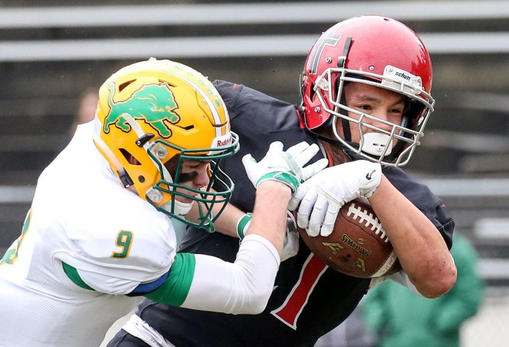 Archbishop Murphy&rsquo;s Collin Montez is hit by Lynden&rsquo;s Landon DeBruin as he crosses the goal line for a touchdown during a 2A state semifinal game Saturday afternoon at Everett Memorial Stadium. The Wildcats won 52-14. (Kevin Clark / The Herald)