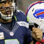 Seahawks quarterback Russell Wilson is hit by Bills linebacker Zach Brown after a pass attempt during Seattle&rsquo;s 31-25 win over Buffalo on Monday night. (Kevin Clark / The Herald)