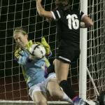 Jackson&rsquo;s Kayleigh Sedlacek blocks a shot attempt by Kamiak&rsquo;s Kailin Wiley during a district playoff match Thursday night Everett Memorial Stadium. (Kevin Clark / The Herald)