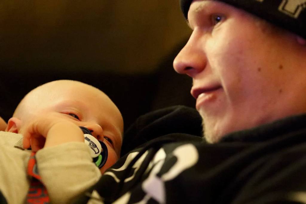 Jacob Varnes holds his son, Brayden Varnes, at the home of Jessiana King, mother, in Granite Falls. (Kevin Clark / The Herald)