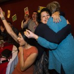Ian Terry / The Herald State Representative Lillian Ortiz-Self (center) hugs Mary Helen Roberts as Priscilla Marin (left) cheers after results came in showing Ortiz-Self leading her race during a democrat viewing party at Nile Shriners in Mountlake Terrace on Tuesday, Nov. 8. Photo taken on 11082016                                During a Democratic party at Nile Shriners in Mountlake Terrace on Tuesday, 21st District state Rep. Lillian Ortiz-Self (center) hugs Mary Helen Roberts after hearing results that Ortiz-Self was leading in her bid for re-election. (Ian Terry / The Herald)