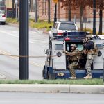 Members of the Columbus SWAT team work the scene around a parking garage after reports of a shooting on the campus of Ohio State University on Monday, Nov. 28, in Columbus, Ohio. (AP Photo/Jay LaPrete)