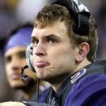Washington quarterback Jake Browning reacts to the action on the field late in the fourth quarter Saturday night at Husky Stadium in Seattle. (Kevin Clark / The Herald)