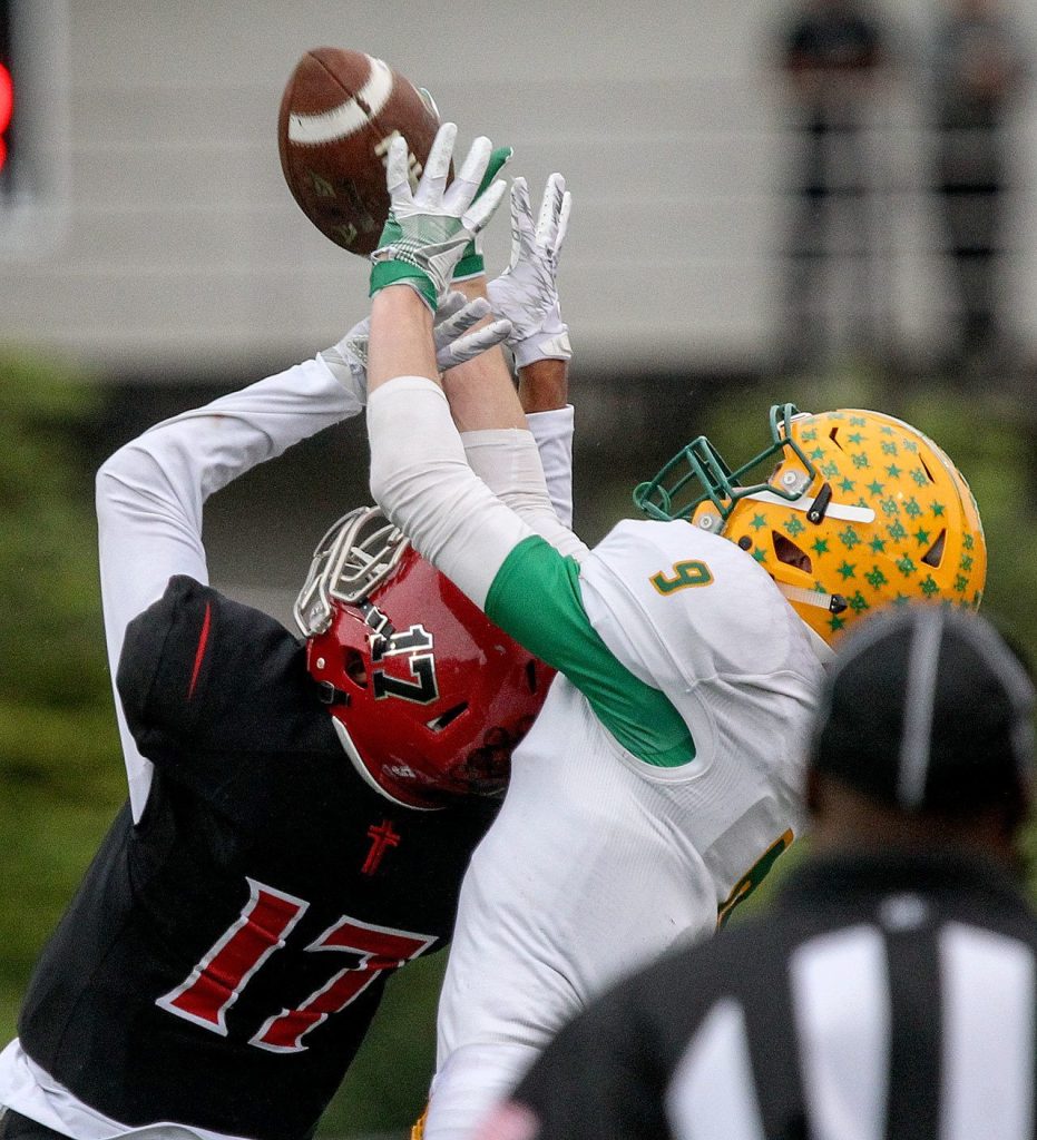 Archbishop Murphy&rsquo;s Dillon Singh Halpin breaks up a pass intended for Lynden&rsquo;s Landon DeBruin during a 2A state semifinal game Saturday afternoon at Everett Memorial Stadium. The Wildcats won 52-14. (Kevin Clark / The Herald)