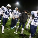 Meadowdale players walk off the field after losing to O&rsquo;Dea in a 3A state semifinal game Saturday at Pop Keeney Stadium in Bothell. O&rsquo;Dea won 35-9. (Kevin Clark / The Herald)