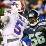 Bills quarterback Tyrod Taylor looks to pass with Seahawks defensive lineman Cliff Avril closing during Seattle&rsquo;s 31-25 win over Buffalo on Monday night. (Kevin Clark / The Herald)