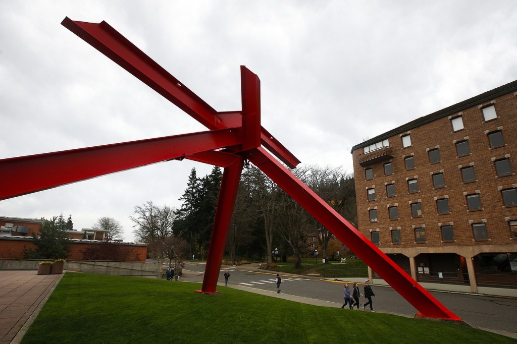 Mark di Suvero&rsquo;s &ldquo;For Handel&rdquo; sculpture towers above pedestrians on the Western Washington University campus on Friday, Nov. 11. A walk through campus gives visitors a chance to see a variety of sculptures from both local and internationally renowned artists. (Ian Terry / The Herald)