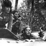 April 1961: Fidel Castro (bottom) looks out from a tank during the Bay of Pigs invasion in Cuba. (AP Photo/Raul Corrales, The Canadian Press, File)