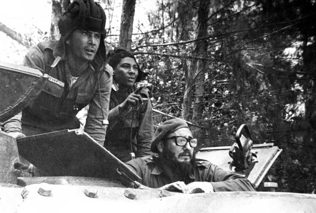 April 1961: Fidel Castro (bottom) looks out from a tank during the Bay of Pigs invasion in Cuba. (AP Photo/Raul Corrales, The Canadian Press, File)