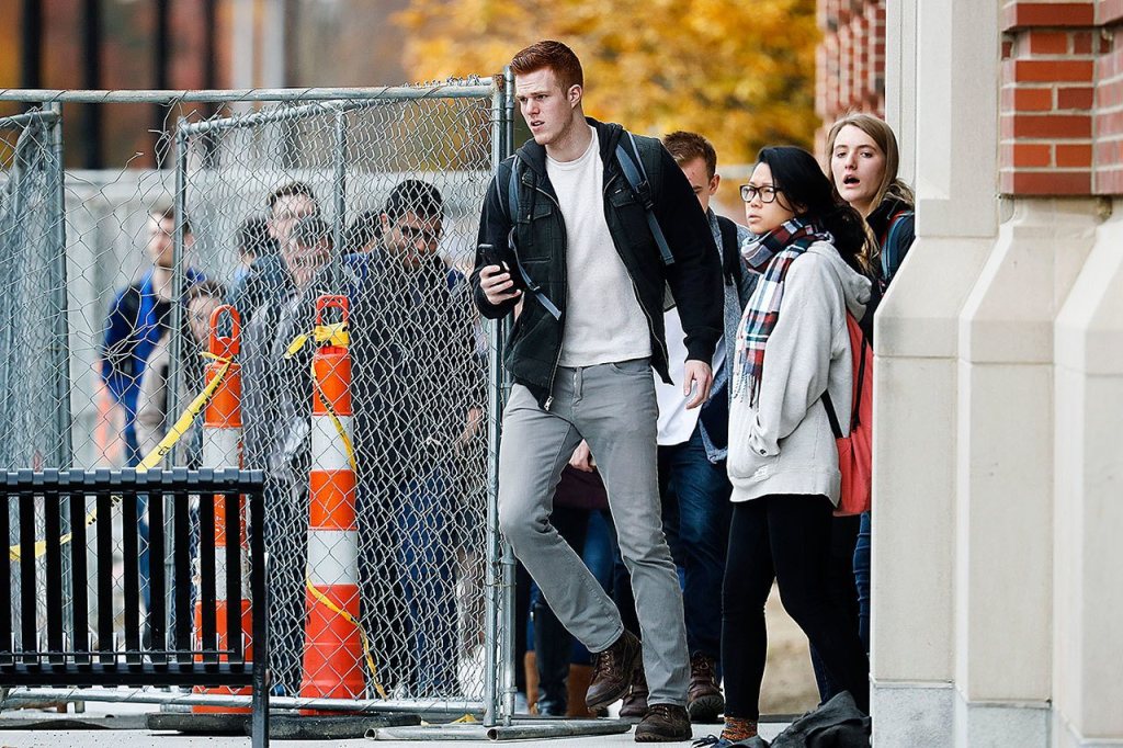 Students leave buildings as police respond to an attack on campus at Ohio State University, Monday, Nov. 28, in Columbus, Ohio. (AP Photo/John Minchillo)