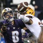 Washington wide receiver Dante Pettis reaches for the ball with Arizona State&rsquo;s Maurice Chandler breaking up the pass Saturday at Husky Stadium in Seattle. (Kevin Clark / The Herald)