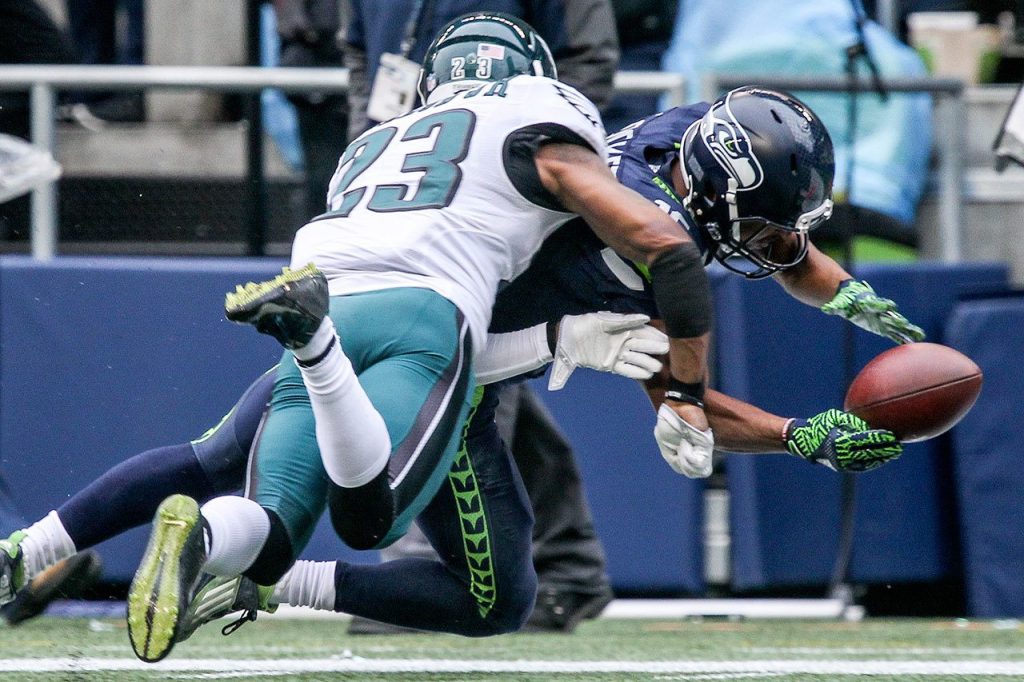 Seahawks wide receiver Tyler Lockett reaches for the goal line and tackled out of bounds by Eagles safety Rodney McLeod Sunday afternoon at CenturyLink Field in Seattle on November 20, 2016. (Kevin Clark / The Herald)