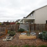 Using recycled wood chips, compost and free materials, Terry Myer&rsquo;s garden needs only a few minutes a week of upkeep to produce thousands of pounds of produce and fruit. (Ian Terry / The Herald)