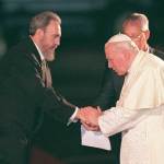 Jan. 25, 1998: Fidel Castro greets former Pope John Paul II at the Jose Marti International Airport in Havana. (AP Photo/Ruth Fremson, File)