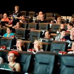 Movie goers watch the pre-preview show at Cinebarre. (Kevin Clark / The Herald)