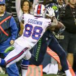 Seahawks cornerback Richard Sherman returns an interception with Bills wide receiver Marquise Goodwin closing during Seattle&rsquo;s 31-25 win over Buffalo on Monday night. (Kevin Clark / The Herald)