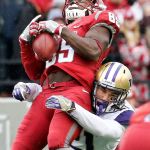 Washington State&rsquo;s John Thompson attempts catch with Washington defensive back Taylor Rapp defending during the Apple Cup on Friday afternoon in Pullman. (Kevin Clark / The Herald)