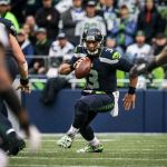 Seahawks quarterback Russell Wilson scrambles against the Philadelphia Eagles Sunday afternoon at CenturyLink Field in Seattle on November 20, 2016. Seahawks won 26-15. (Kevin Clark / The Herald)