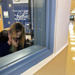 Jessiana King makes the morning announcements, as part of her leadership class, at Crossroads High School in Granite Falls. King is taking part in the GRADS program for teen parents as a full-time student. (Kevin Clark / The Herald)