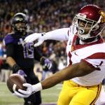 Southern California wide receiver Darreus hangs on to the touchdown reception with Washington linebacker DJ Beavers looking Saturday night at Husky Stadium in Seattle on November 12, 2016. (Kevin Clark / The Herald)