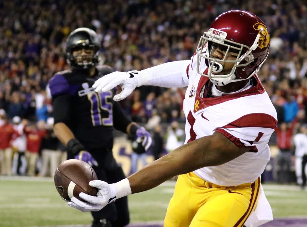 Southern California wide receiver Darreus hangs on to the touchdown reception with Washington linebacker DJ Beavers looking Saturday night at Husky Stadium in Seattle on November 12, 2016. (Kevin Clark / The Herald)
