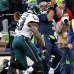 Seahawks quarterback Russell Wilson makes a reception from Seahawks wide receiver Doug Baldwin for a touchdown with Eagles linebacker Nigel Bradham trailing Sunday afternoon at CenturyLink Field in Seattle on November 20, 2016. Seahawks won 26-15. (Kevin Clark / The Herald)