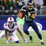 Seahawks wide receiver Tyler Lockett returns a kickoff, leaving Buffalo cornerback Kevon Seymour in his wake during Seattle&rsquo;s 31-25 win over the Bills on Monday night in Seattle. (Kevin Clark / The Herald)