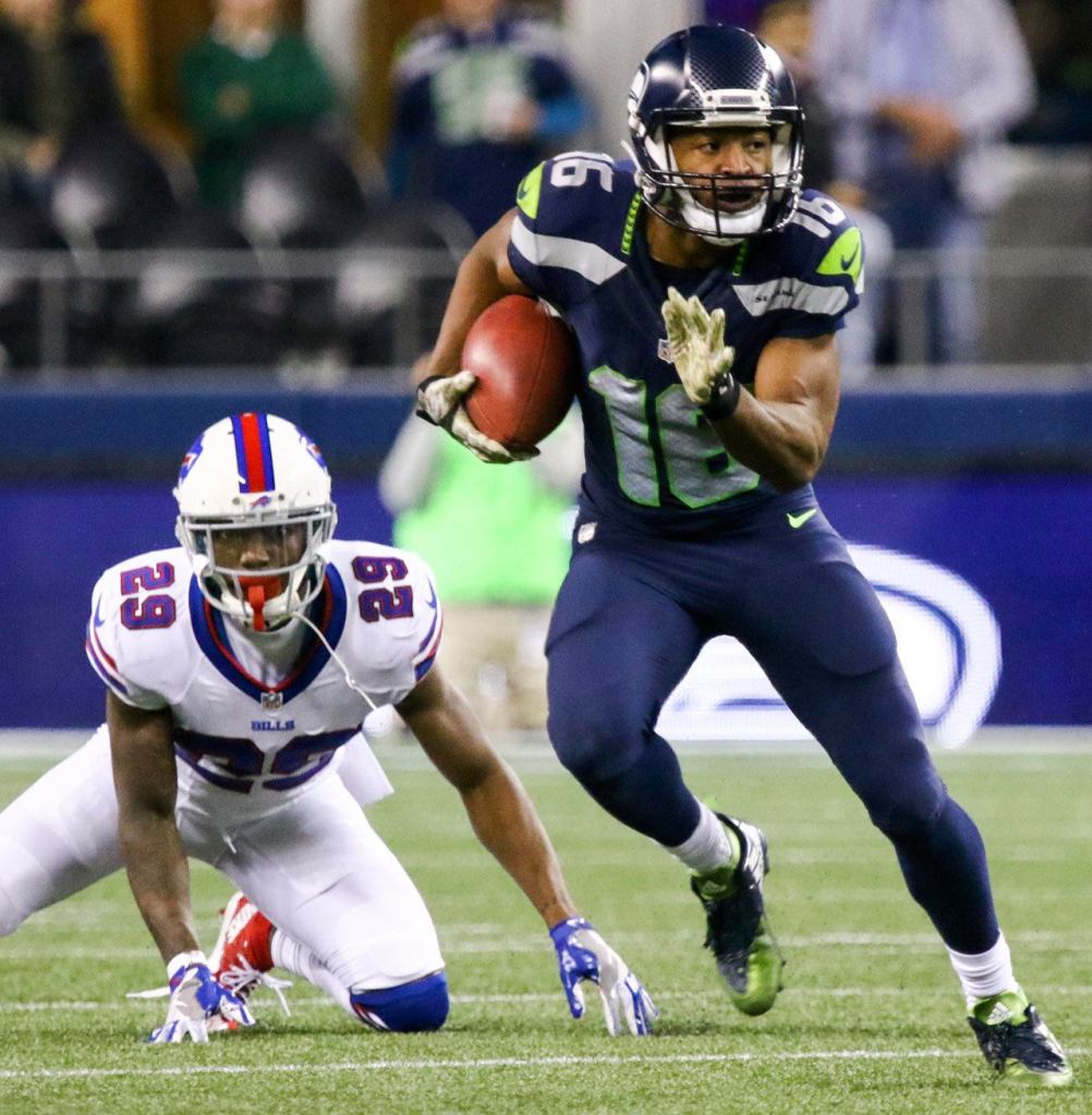 Seahawks wide receiver Tyler Lockett returns a kickoff, leaving Buffalo cornerback Kevon Seymour in his wake during Seattle&rsquo;s 31-25 win over the Bills on Monday night in Seattle. (Kevin Clark / The Herald)