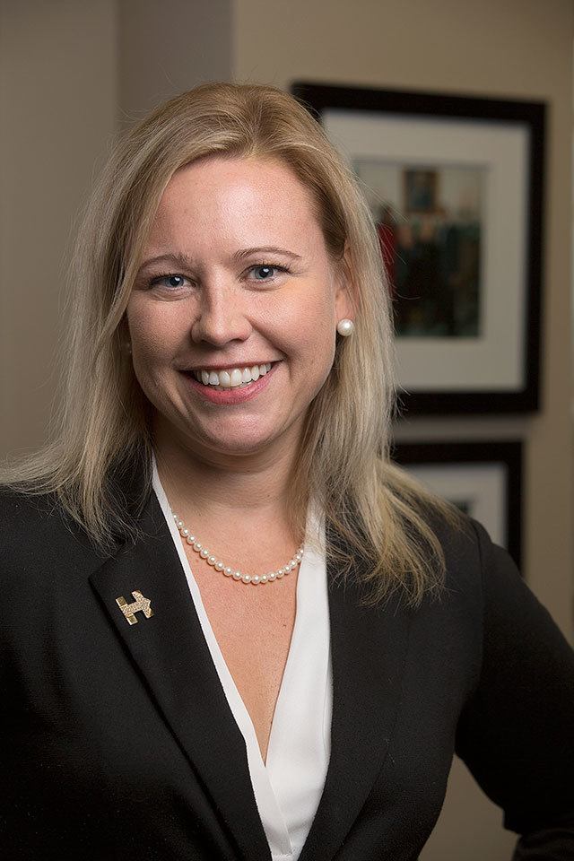 Snohomish County public defender Rachel Forde sports a gold &ldquo;I&rsquo;m With Her&rdquo; pin, supporting Hillary Clinton, on Nov. 7 in Everett. Forde has been a Clinton supporter since her days as a White House intern. (Andy Bronson / The Herald)