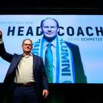 Seattle Sounders head coach Brian Schmetzer waves to the crowd during a meeting with season ticket holders on Wednesday. The Sounders announced at the meeting that they removed the interim tag from Schmetzer&rsquo;s title. (Erika J. Schultz/The Seattle Times via AP)