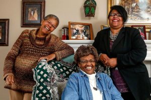 In this photo from last May, sisters, Georgina &ldquo;Genie&rdquo; Paul, 69, left, Marilyn Quincy, 72 and Mary Barrett, 55 share a lighter moment during an interview and photo shoot May 19. (Dan Bates / The Herald)