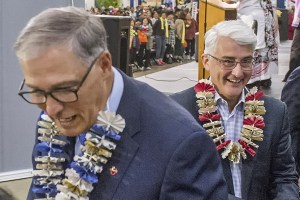 Governor Jay Inslee (left) and Republican candidate for governor Bill Bryant chat with the organizers of the Asian Pacific American Community Summit at the Tacoma Dome Exhibition Hall on Sept. 15. The two candidates had just come off the stage where they answered quesitons in a forum which included translation for speakers of 27 different languages. (Peter Haley/The Tacoma News Tribune)