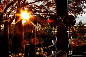 At only 4:05 PM, the low winter sun streaks through Larry and Linda Jubie&rsquo;s living room, catching on glass bulbs, snowflakes and other holiday gems, all within the watchful gaze of the family&rsquo;s snow man. (Dan Bates / The Herald)