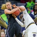 Washington&rsquo;s Katie Collier (13) battles with Notre Dame&rsquo;s Arike Ogunbowale (24) for control of the ball during the second half of Sunday&rsquo;s women&rsquo;s college basketball game in South Bend, Ind. (AP Photo/Robert Franklin)