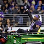 Washington linebacker Azeem Victor gives a thumbs-up as he leaves the field on a cart Saturday after being injured in the Huskies&rsquo; game against Southern California. (AP Photo/Elaine Thompson)