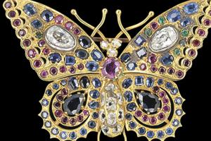 Butterflies bring change and transformation, according to past traditions. Or they may represent a free spirit. The beauty of this butterfly pin made of precious jewels and gold brought an auction bid of $5,000. It was made in Russia a hundred years ago.