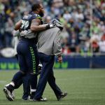 Seahawks defensive end Michael Bennett leaves the field with an injury in the second half of an Oct. 16 game in Seattle. (AP Photo/Elaine Thompson)