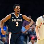 Gonzaga forward Johnathan Williams (left) celebrates after forcing a turnover as Arizona forward Lauri Markkanen looks on during the second half of a game Saturday in Los Angeles. (AP Photo/Mark J. Terrill)