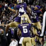 Washington wide receiver John Ross (1) celebrates his touchdown catch with teammates, including Sidney Jones (26) and Chico McClatcher (6), during the second half of the Pac-12 Conference championship game against Colorado on Friday in Santa Clara, Calif. (AP Photo/Marcio Jose Sanchez)
