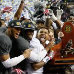 Alabama team members celebrate after beating Florida 54-16 the Southeastern Conference championship game Saturday in Atlanta. (AP Photo/John Bazemore)