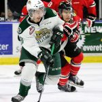 The Silvertips&rsquo; Patrick Bajkov handles the puck in front of the Winterhawks&rsquo;s Miles Koules during a game last season at Xfinity Arena in Everett. (Kevin Clark / The Herald)
