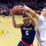 Gonzaga guard Nigel Williams-Goss (left) grabs a rebound away from Arizona forward Lauri Markkanen during the second half of a game Saturday in Los Angeles. (AP Photo/Mark J. Terrill)