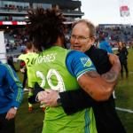 Sounders head coach Brian Schmetzer (rear) hugs defender Roman Torres after defeating the Rapids in the Western Conference finals Nov. 27 in Commerce City, Colo. (AP Photo/David Zalubowski)