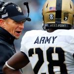 Army head coach Jeff Monken (left) talks with cornerback Brandon Jackson (28) during a game against Penn State last season in State College, Pa. (AP Photo/Gene J. Puskar)