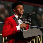 Louisville&rsquo;s Lamar Jackson holds up the Heisman Trophy after winning the award Saturday in New York. (Todd Van Emst/Heisman Trophy Trust via AP)