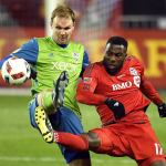 Sounders defender Chad Marshall (left) and Toronto FC forward Jozy Altidore (17) battle for the ball during second-half the MLS Cup final on Saturday in Toronto. (Franks Gunn / The Canadian Press via AP)